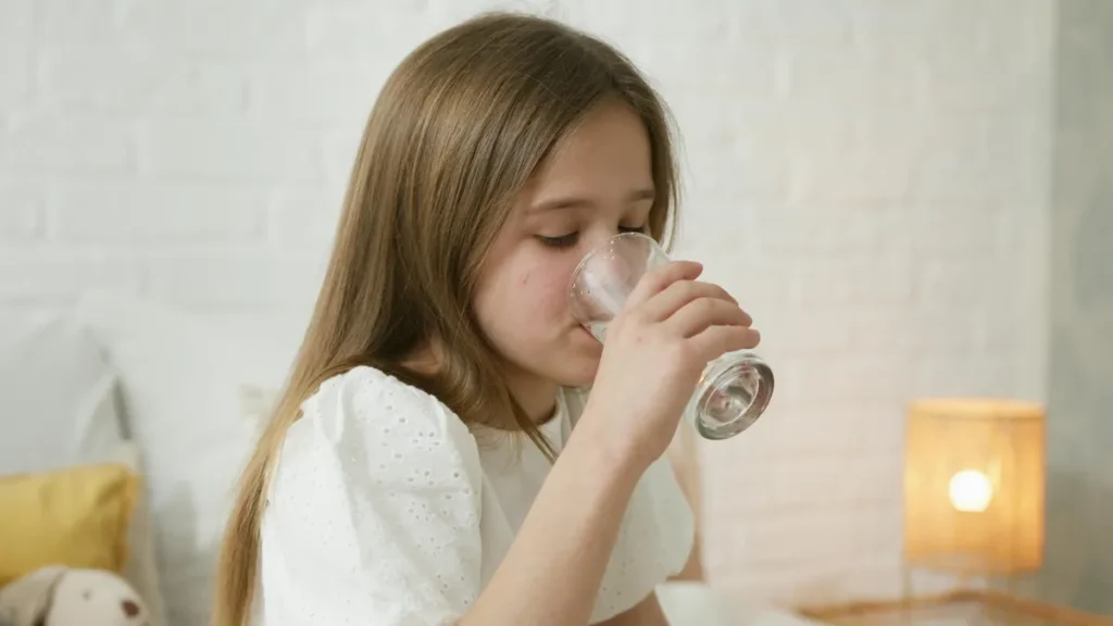 Girl drinking a glass of water
