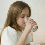 Girl drinking a glass of water