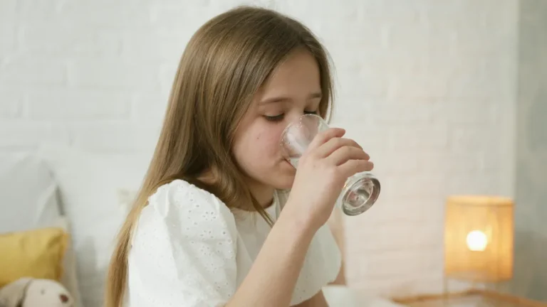 Girl drinking a glass of water