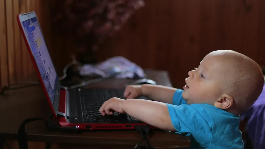 Baby looking at laptop