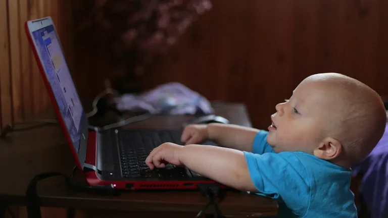 Baby looking at laptop