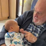 James Harrison with a baby