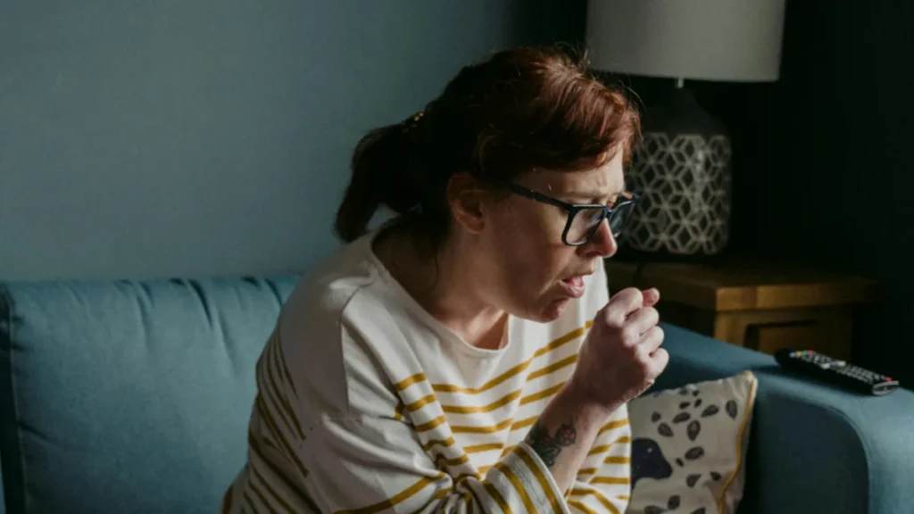 Woman coughing