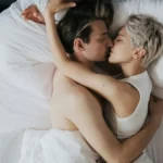 Couple kissing on bed