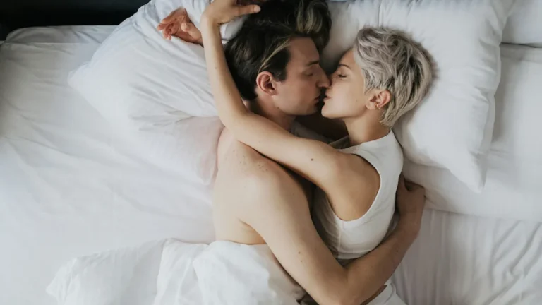 Couple kissing on bed