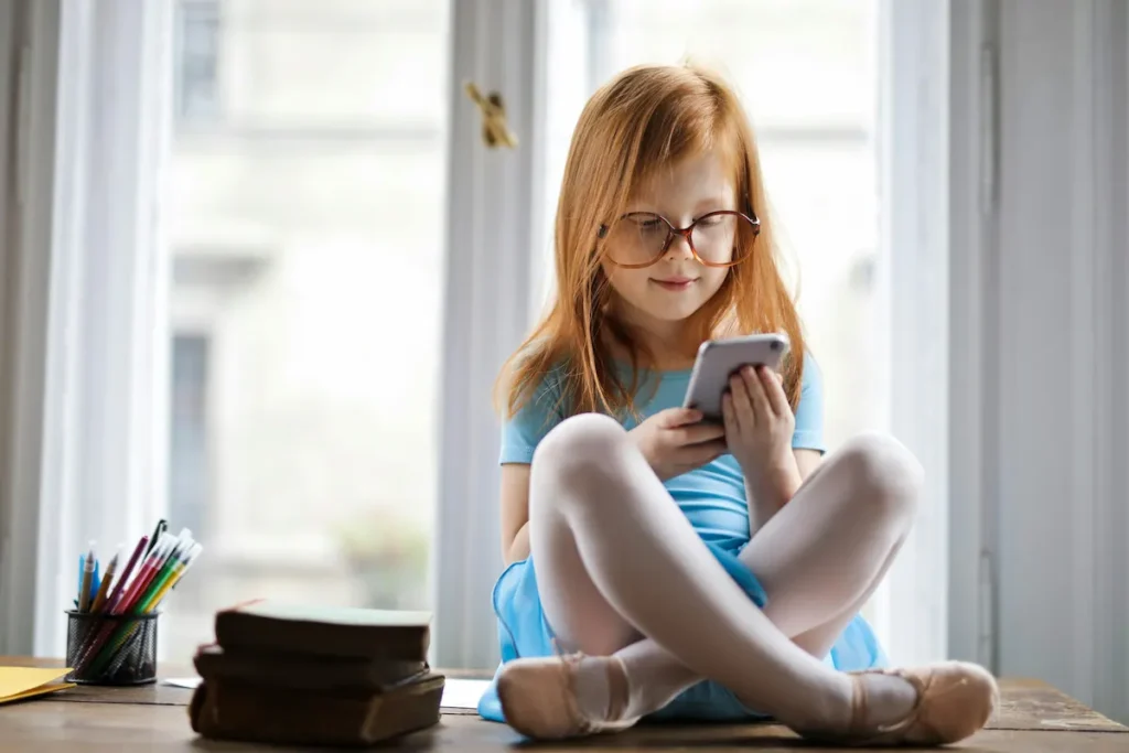 Girl with glasses using phone