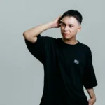 Man scratching his head