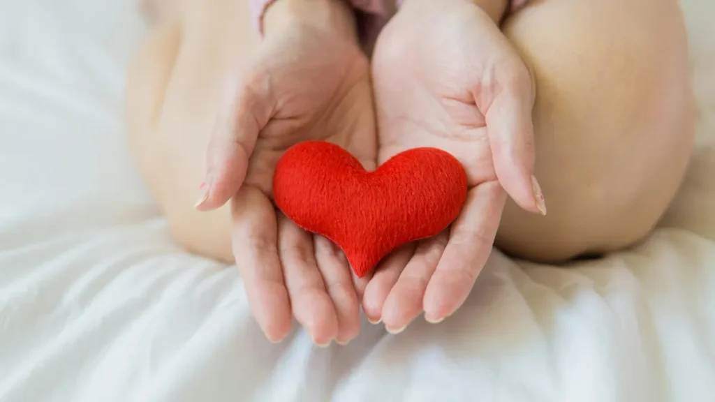 Holding a fake heart