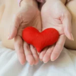 Holding a fake heart