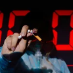 A person holding a mask and a broken cigarette