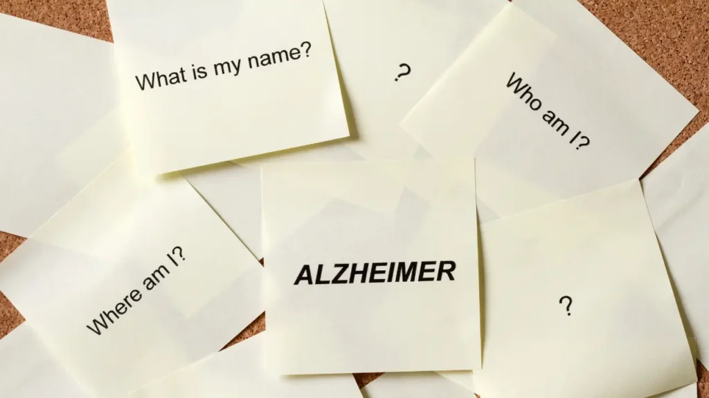 Σημειώσεις post-it με τη λέξη ALZHEIMER και ερωτήσεις για την απώλεια μνήμης